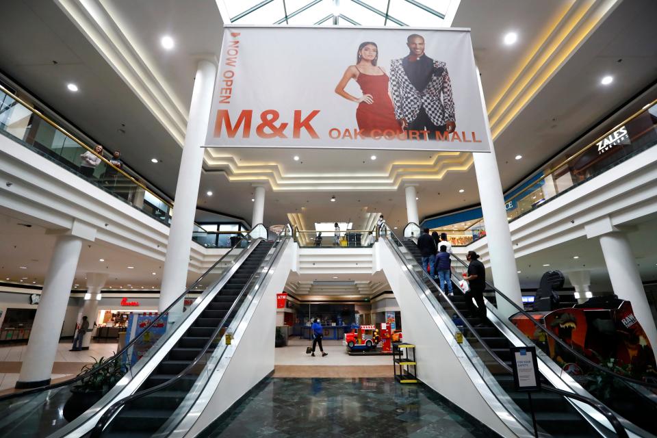 Shoppers make their way through Oak Court Mall on its second day after reopening after the Memphis safer-at-home initiative, on Tuesday, May 12, 2020. 