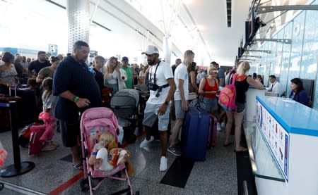 Passengers are seen at check-in points at Enfidha-Hammamet International Airport