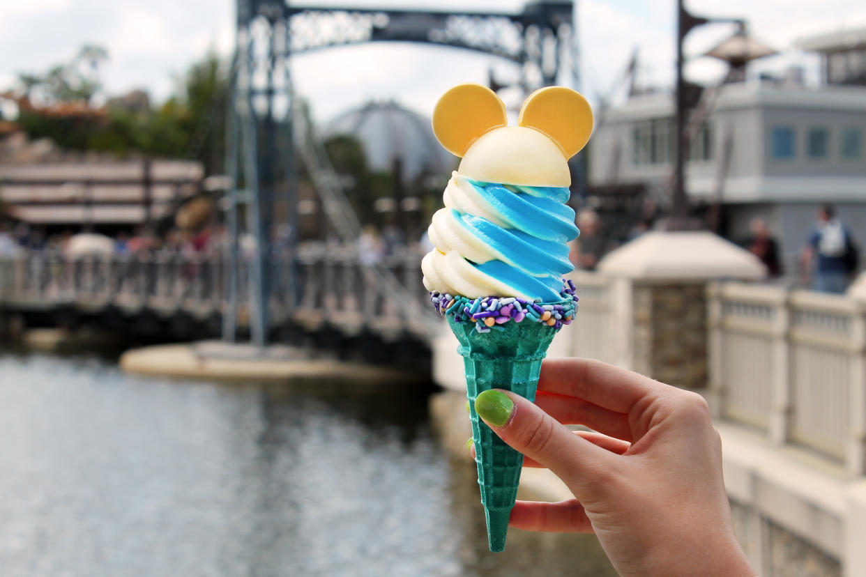 The 50th Celebration Cone features lemon Dole Whip and cookie dough soft-serve in a cone with iridescent sprinkles and a Mickey Mouse topper. (Photo: Walt Disney World)