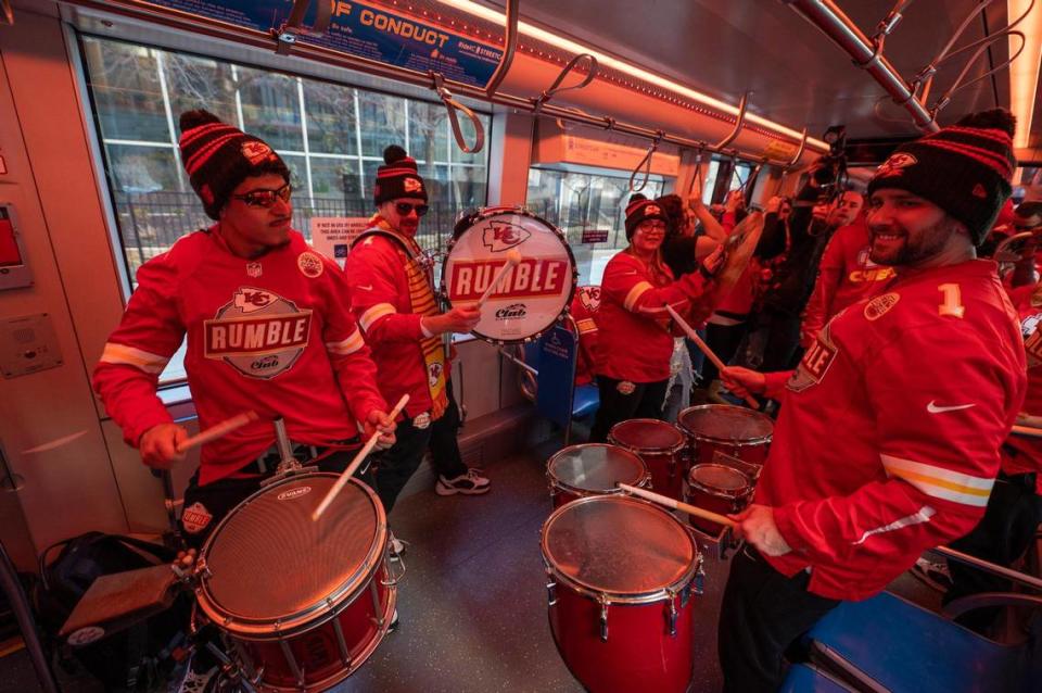 The Rumble drum corp for the Kansas City Chiefs road the KC Streetcar during a Red Friday rally on Feb. 10, 2023, in Kansas City. The drummers were on the streetcar for a rolling Red Friday rally to fire up Chiefs fans for Super Bowl LVII.