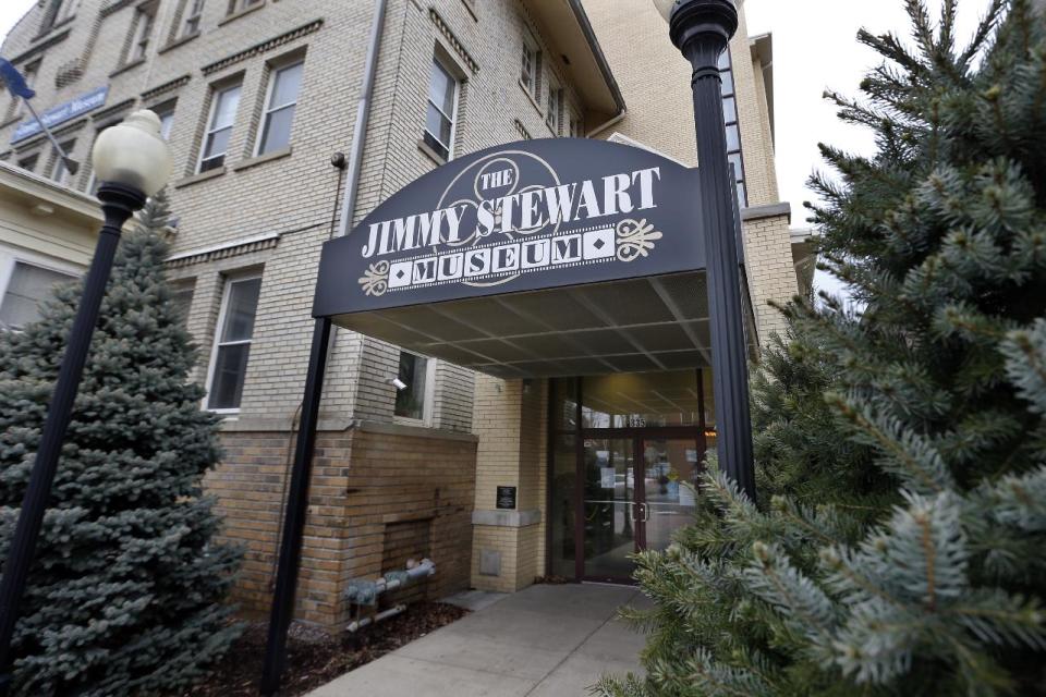 In this photo made on Friday, Dec. 20, 2013, a canopy covers the entrance to the Jimmy Stewart Museum in indiana, Pa. The museum dedicated to the life of the star of many films including the holiday favorite "It's A Wonderful Life" is located in the off-the-beaten track town where Stewart grew up. The museum still attracts visitors from all over the country. It’s full of displays not just about Hollywood, but about Stewart’s service as a bomber pilot in World War II, his well-to-do ancestors, and his family life. (AP Photo/Keith Srakocic)