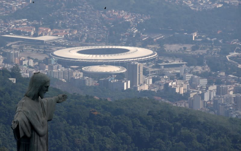 FILE PHOTO: An aerial view shows the Christ the Redeemer statue with the Maracana stadium during the coronavirus disease (COVID-19) outbreak, in Rio de Janeiro