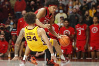 Rutgers guard Ron Harper Jr. (24) fouls Minnesota guard Sean Sutherlin (24) in the closing seconds of the second half of an NCAA college basketball game Saturday, Jan. 22, 2022, in Minneapolis. Minnesota won 68-65. (AP Photo/Bruce Kluckhohn)