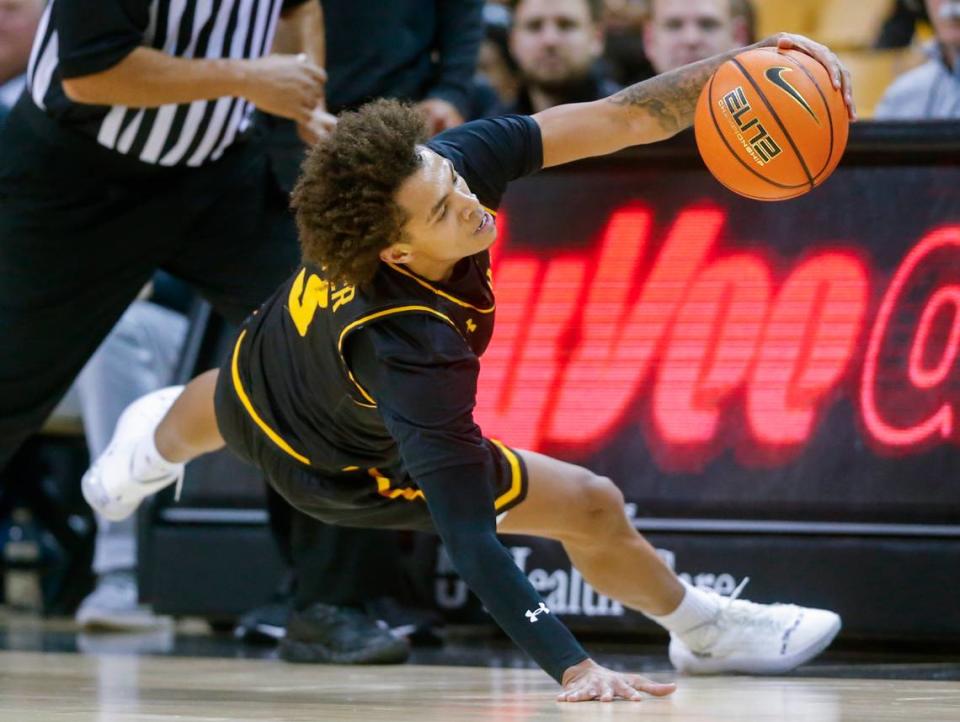Wichita State’s Craig Porter IV slides out of bounds while trying to come up with a steal during the first half against Missouri on Friday night in Columbia.