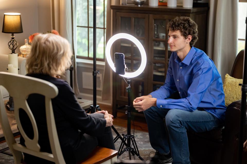 Tova Friedman and Aron Goodman filming a video.