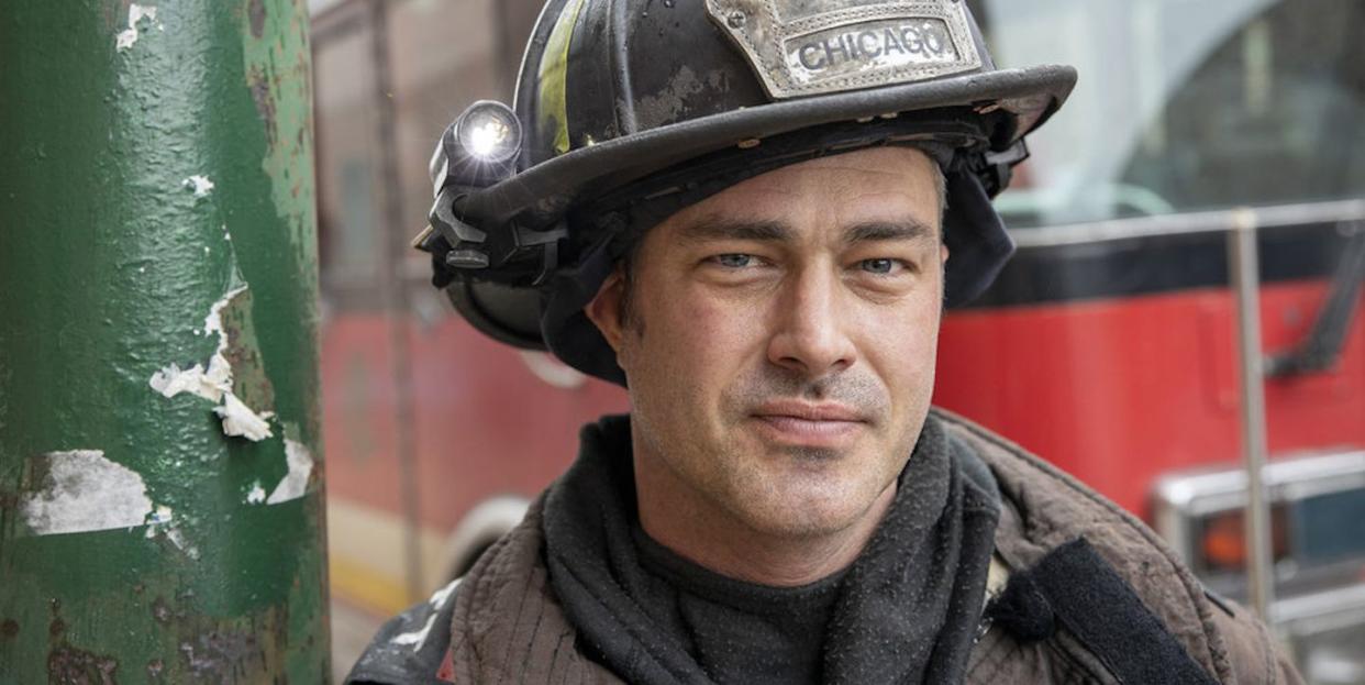 taylor kinney wearing fire uniform in chicago fire