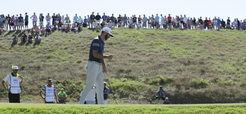 Dustin Johnson pumps his fist as he birdies the 16th hole to win his quarterfinals match over Alex Noren of Sweden at the Dell Technologies Match Play golf tournament at Austin County Club, Saturday, March 25, 2017, in Austin, Texas. (AP Photo/Eric Gay)