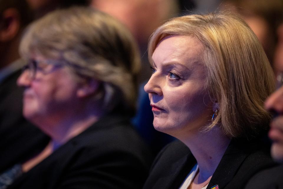 British prime minister Liz Truss (R) listens to chancellor Kwasi Kwarteng’s keynote speech at Conservative Party Conference in Birmingham, Britain, 03 October 2022 (EPA)