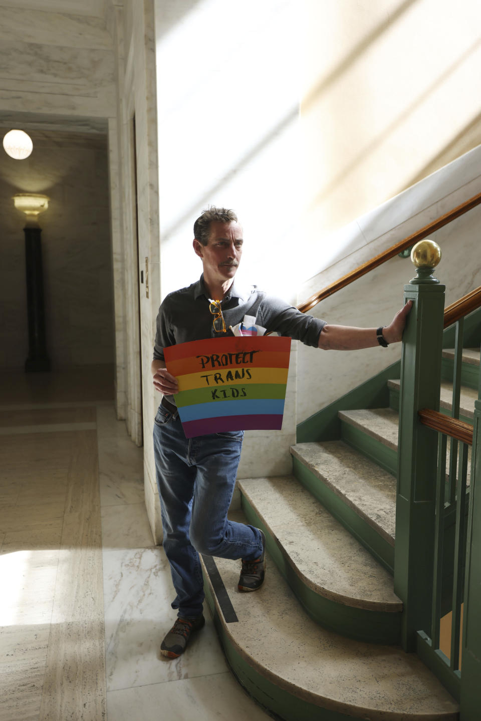 Bil Lepp, who's daughter is trans, holds a sign during a pretest rally of HB 2007, which would ban health care for children, at the state capitol in Charleston, W.Va., on March 9, 2023. "I support the trans community as a father of a trans child," Lepp said. "I think it's important to show that there is support for trans people in the state." (AP Photo/Chris Jackson)