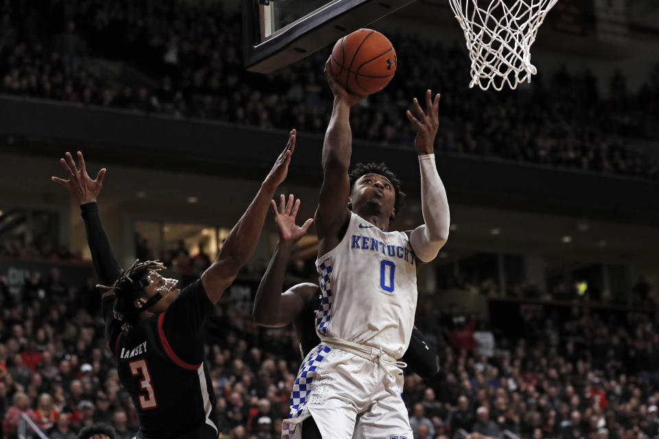 Kentucky's Ashton Hagans (0) lays up the ball during the first half of an NCAA college basketball game against Texas Tech, Saturday, Jan. 25, 2020, in Lubbock, Texas. (AP Photo/Brad Tollefson)