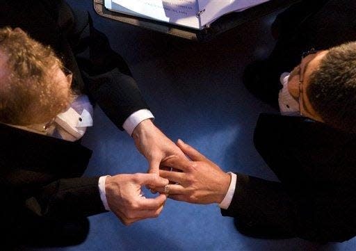 Exchanging marriage vows at City Hall in San Francisco in 2008.