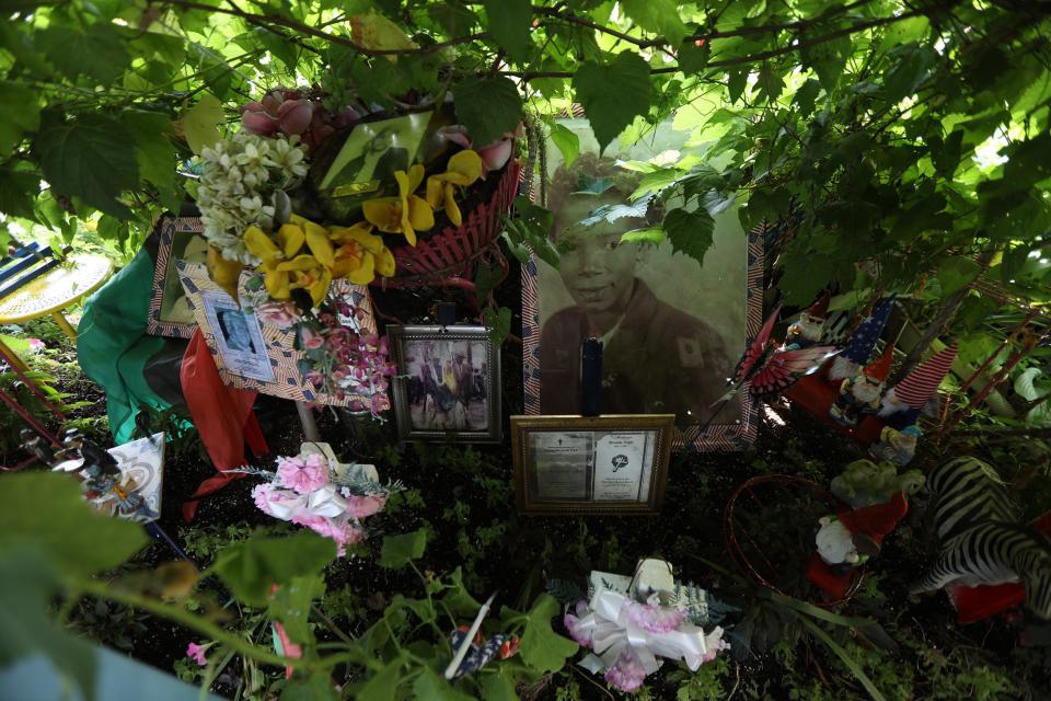 Walter Myles' garden at his home on Humboldt Parkway in Buffalo, in addition to plants and flowers, also features portraits of influential people who have, in Myles' view, made a positive impact on the world.