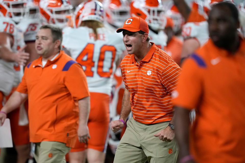 Clemson coach Dabo Swinney encourages players before the team's Orange Bowl NCAA college football game against Tennessee, Friday, Dec. 30, 2022, in Miami Gardens, Fla. (AP Photo/Rebecca Blackwell)