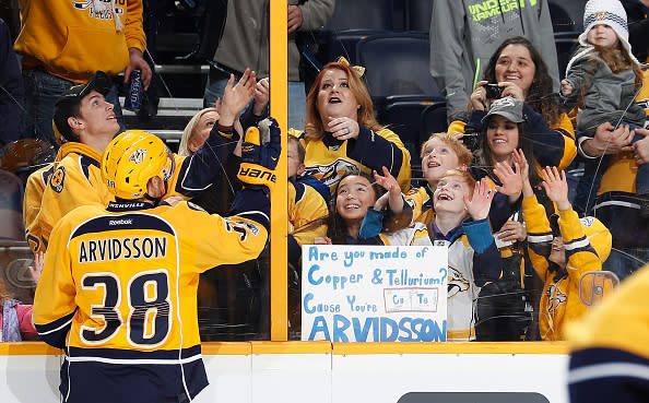NASHVILLE, TN – FEBRUARY 2: Viktor Arvidsson #38 of the Nashville Predators tosses a puck to young fans during warmups against the Edmonton Oilers during an NHL game at Bridgestone Arena on February 2, 2017 in Nashville, Tennessee. (Photo by John Russell/NHLI via Getty Images)
