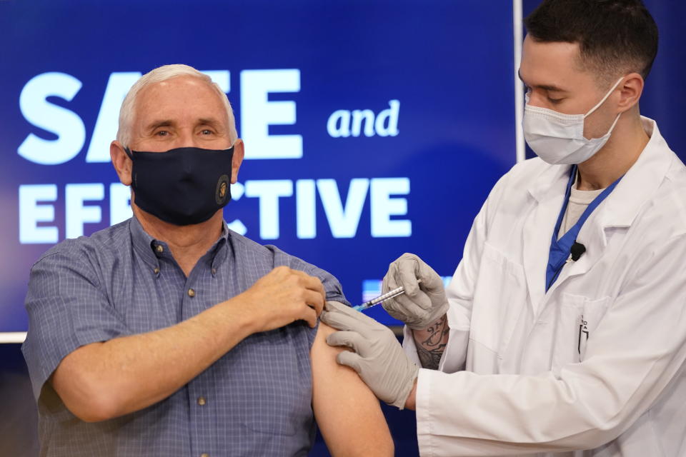 Vice President Mike Pence receives a Pfizer-BioNTech COVID-19 vaccine shot at the Eisenhower Executive Office Building on the White House complex, Friday, Dec. 18, 2020, in Washington. Karen Pence, and U.S. Surgeon General Jerome Adams also participated. (AP Photo/Andrew Harnik)