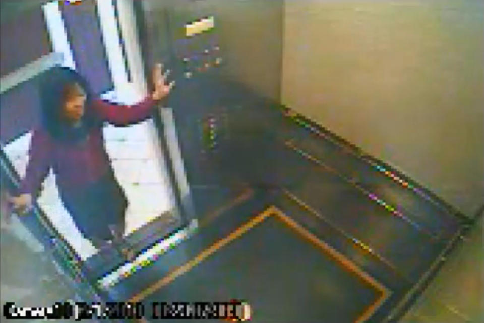 This still image taken from a security video was released on Feb. 13, 2013, by the Los Angeles Police Department in connection with the search for 21-year-old missing Canadian tourist Elisa Lam. In this image, a woman believed to be Lam enters an elevator in the Cecil Hotel in downtown Los Angeles on Thursday, Jan. 31, the last day she was seen alive. A maintenance worker at the hotel found Lam's body in a water cistern on the building's roof on Feb. 19, more than two weeks after she had gone missing. (AP Photo/Los Angeles Police Department)