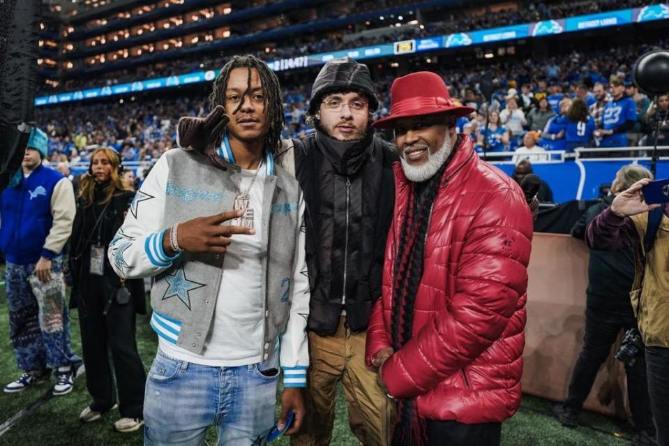 Rapper Jack Harlow (center) poses with Detroit singer-songwriter Cadillac Dale (right) and rapper Skilla Baby at Ford Field in Detroit on Nov. 23, 2023. Harlow gave shout-outs to both during his Detroit Lions halftime set.