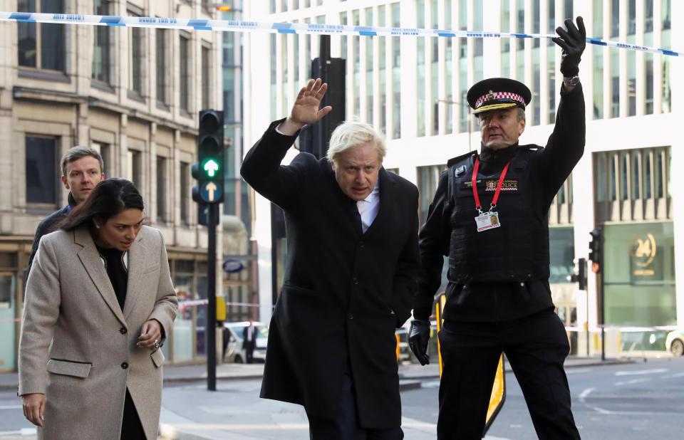 (left to right) Home Secretary Priti Patel, Prime Minister Boris Johnson and Commissioner of the City of London Police Ian Dyson attend the London Bridge crime scene in central London after a terrorist wearing a fake suicide vest who went on a knife rampage killing two people, was shot dead by police.