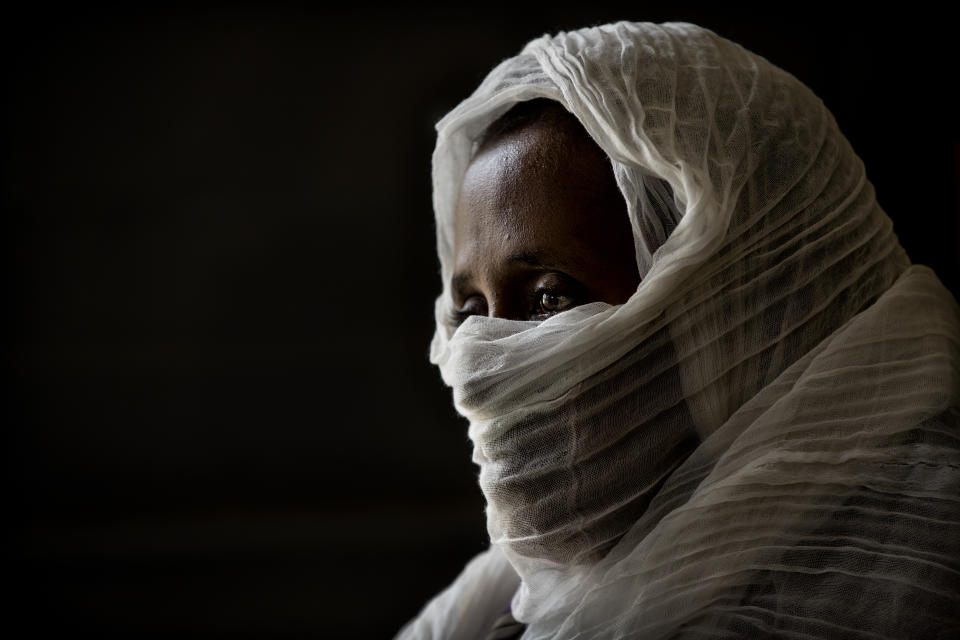 FILE - A 40-year-old woman who says she was held captive and repeatedly raped by 15 Eritrean soldiers over a period of a week in a remote village near the Eritrea border, speaks during an interview at a hospital in Mekele, in the Tigray region of northern Ethiopia on May 14, 2021. A year after war began there, the findings of the only human rights investigation allowed in Ethiopia's blockaded Tigray region will be released Wednesday, Nov. 3, 2021. (AP Photo/Ben Curtis, File)