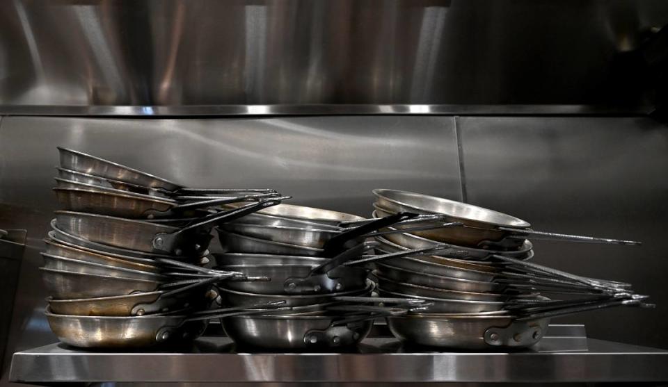 Pans stacked in the kitchen at Taverna Toscana at 1301 Sixth Ave. W. on Friday, May 10, 2024.