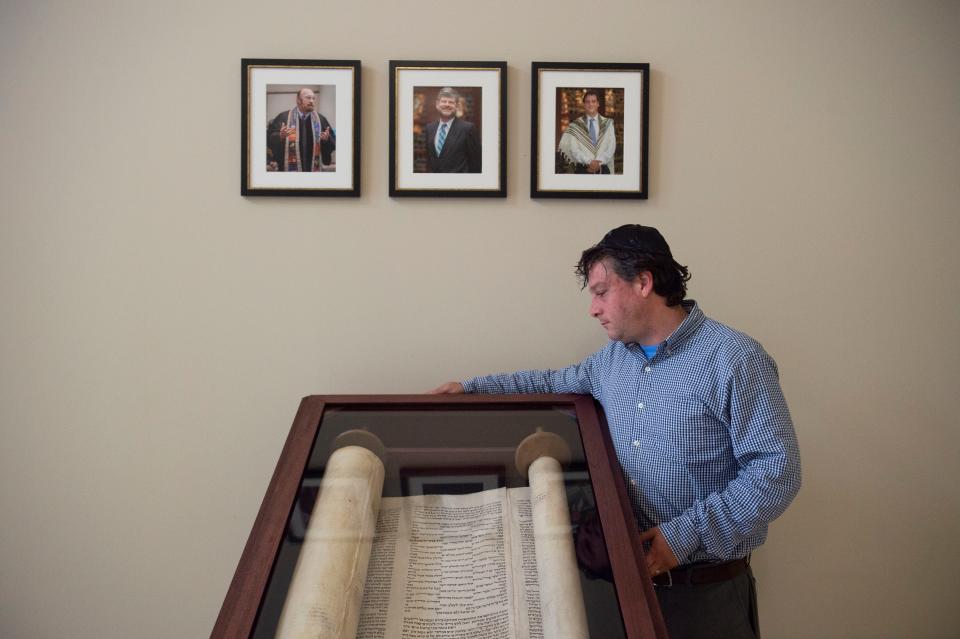 A Holocaust-era Torah scroll, seen Thursday, Jan. 31, 2019, at Temple Beit HaYam in Stuart, will be debuted in a new display at a special Shabbat evening service Feb. 15 at 7:30 p.m. The Torah scroll has been at the temple since the 1990s, but Rabbi Matt Durbin wanted it to be more visible, so a core group of the temple's community raised money for the custom made case so it would be on display. "It's quite humbling," Durbin said of the scroll. "The intent is that (the temple congregation will) see it and connect with it and some way." 