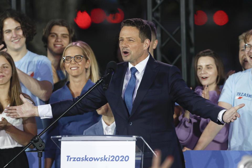 Presidential candidate Rafal Trzaskowski gestures while addressing supporters at the end of the election day in Warsaw, Poland, Sunday, July 12, 2020. Voting ended in Poland's razor-blade-close presidential election runoff between the conservative incumbent Andrzej Duda and liberal, pro-European Union Warsaw Mayor Rafal Trzaskowski with exit polls showing the election is too close to call. (AP Photo/Petr David Josek)