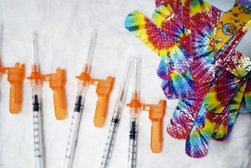 FILE - Syringes and colorful bandages are prepared as children from local schools prepare to get COVID-19 vaccines in Pittsfield, Mass., on Monday Dec. 13, 2021. A review by federal health officials finds that Pfizer's COVID-19 vaccine appears safe and effective for children under 5, the only group not currently eligible for vaccination. The review issued Sunday, June 12, 2022, by the Food and Drug Administration is a key step toward a decision on vaccinations for babies, toddlers and preschoolers, perhaps as soon as June 21. (Ben Garver/The Berkshire Eagle via AP, File)