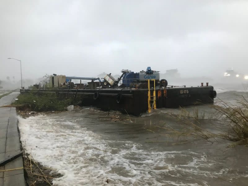 A Skanska company barge run aground along Bayfront Parkway from winds of Hurricane Sally is seen in Pensacola