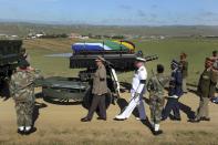 The coffin of former South African President Nelson Mandela arrives on a gun carriage for his funeral ceremony in Qunu, Eastern Cape in this December 15, 2013 handout picture provided by the South African Government Communication and Information System (GCIS). REUTERS/Elmond Jiyane/GCIS/Handout via Reuters (SOUTH AFRICA - Tags: MILITARY SOCIETY OBITUARY POLITICS TPX IMAGES OF THE DAY) ATTENTION EDITORS - THIS IMAGE HAS BEEN SUPPLIED BY A THIRD PARTY. IT IS DISTRIBUTED, EXACTLY AS RECEIVED BY REUTERS, AS A SERVICE TO CLIENTS. FOR EDITORIAL USE ONLY. NOT FOR SALE FOR MARKETING OR ADVERTISING CAMPAIGNS. NO SALES. NO ARCHIVES