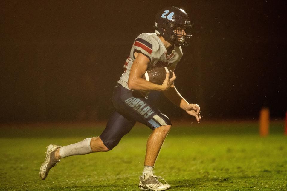 Maclay running back Shane Croston (24) brings the ball down the field. The Maclay Marauders hosted the St. John Paul II Panthers for a rainy Friday night football game Sept. 9, 2022.