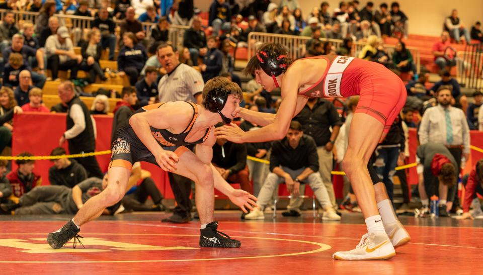 Somerville’s Joe Aldrich (green) beats Bound Brooke’s Sean Markey (red) in the 120 weight class at the 2023 Somerset County Boys Wrestling Tournament on Jan. 7 at the gymnasium at Hillsborough High School in Hillsborough.