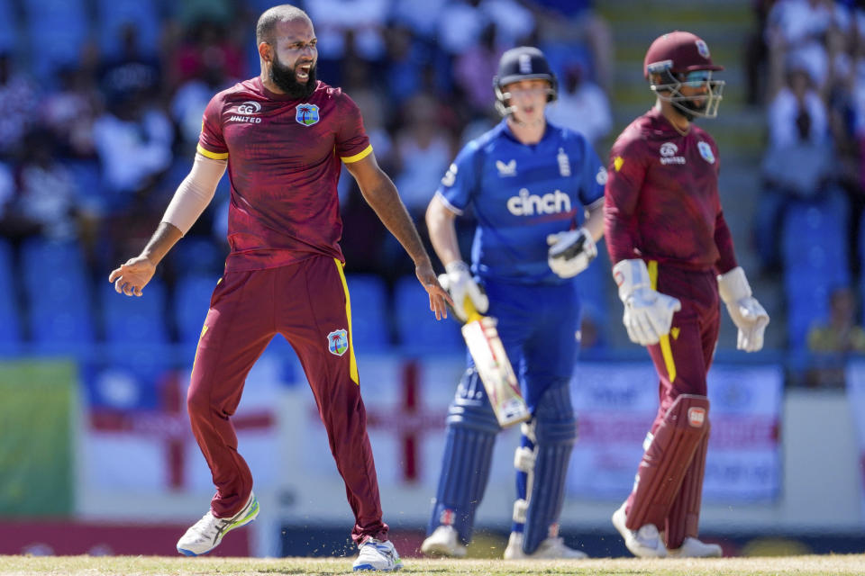 West Indies' bowler Yannic Cariah gestures after teammate Gudakesh Motie dropped the catch from shot played by England's Zak Crawley during the first ODI cricket match at Sir Vivian Richards Stadium in North Sound, Antigua and Barbuda, Sunday, Dec. 3, 2023. (AP Photo/Ricardo Mazalan)