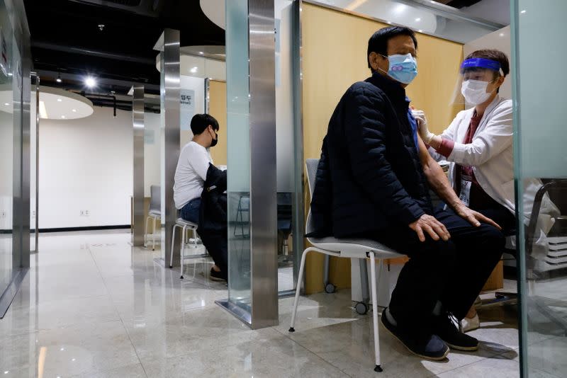 A man gets an influenza vaccine at a branch of the Korea Association of Health Promotion in Seoul