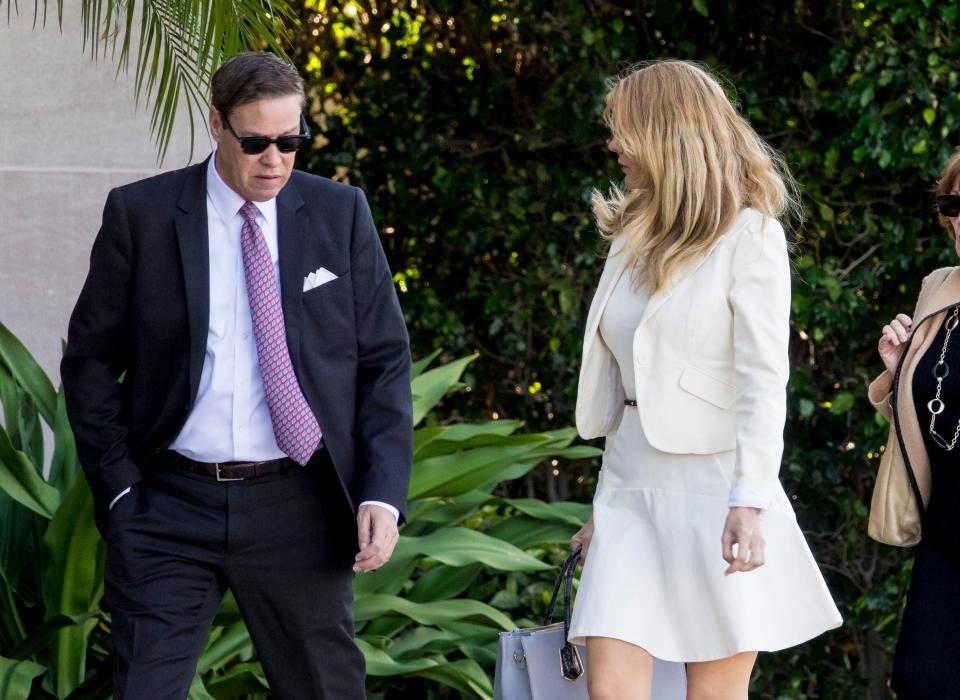 Robert V. Matthews arrives with his then-wife Mia for a hearing related at the federal courthouse in West Palm Beach on March 23, 2018.