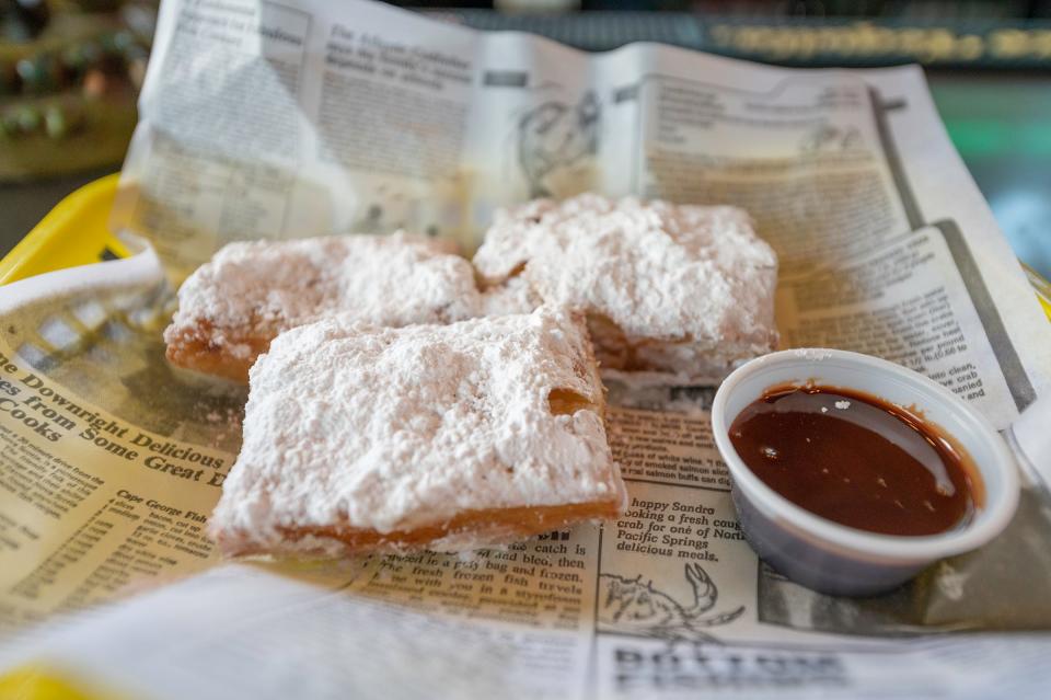 Powdered-sugar-dusted beignets are one of the sweet treats available at the new Lobos at Creole Magnolias located at 2290 Rawlings Blvd.