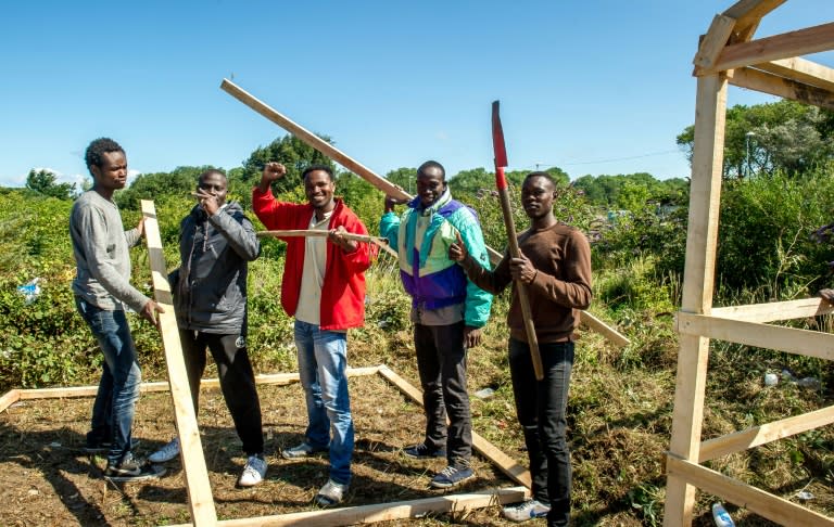 Migrants from Sudan build a hut at a site dubbed "new jungle" -- where migrants trying to reach Britain have camped out near Calais, on July 29, 2015