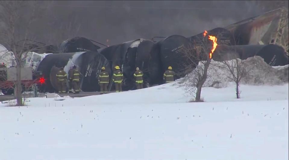 This photo provided KSTP,  emergency personnel respond to the scene of a train derailment early Thursday, March 30, 2023 in Raymond, Min.  A train hauling ethanol and corn syrup derailed and caught fire and nearby residents were ordered to evacuate their homes, authorities said.