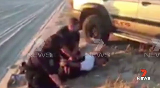 Exclusive Seven News video of his arrest shows Heinze face down in the Coorong sand, his hands cuffed behind his back. Picture: 7 News