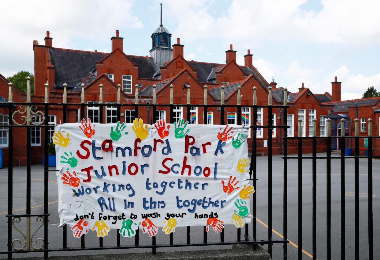 A banner painted by children and tied to the school railings of Stamford Park Junior School is seen on May 4, 2020, in Altrincham, United Kingdom. The country continued quarantine measures intended to curb the spread of COVID-19, but the infection rate is falling, and government officials are discussing the terms under which it would ease the lockdown.