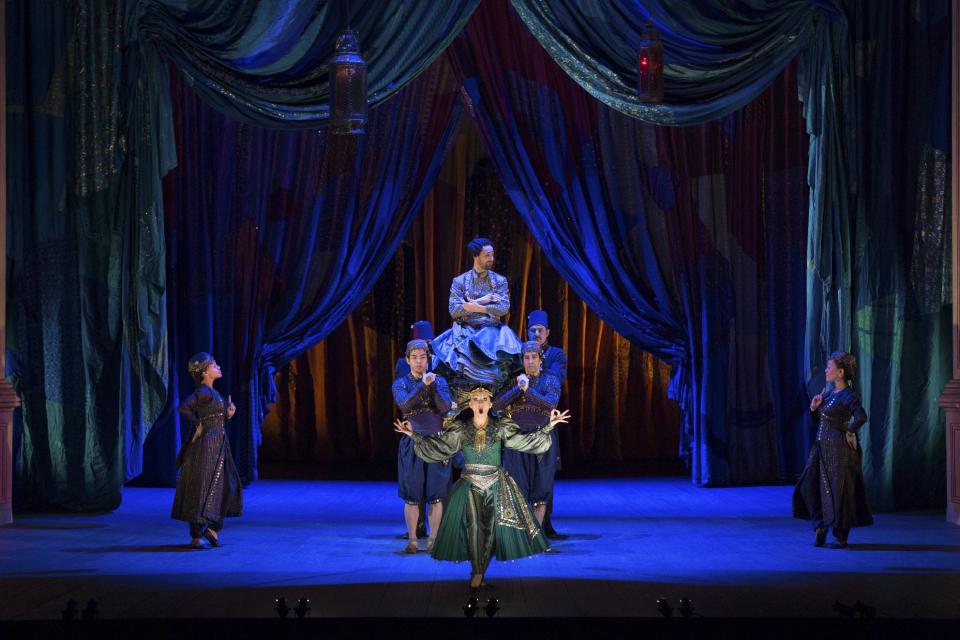 In this March 25, 2013 photo provided by the Metropolitan Opera, Natalie Dessay as Cleopatra, bottom, and Christophe Dumaux as Tolomeo, top, perform during a rehearsal of Handel's "Giulio Cesare." (AP Photo/ Metropolitan Opera, Marty Sohl)