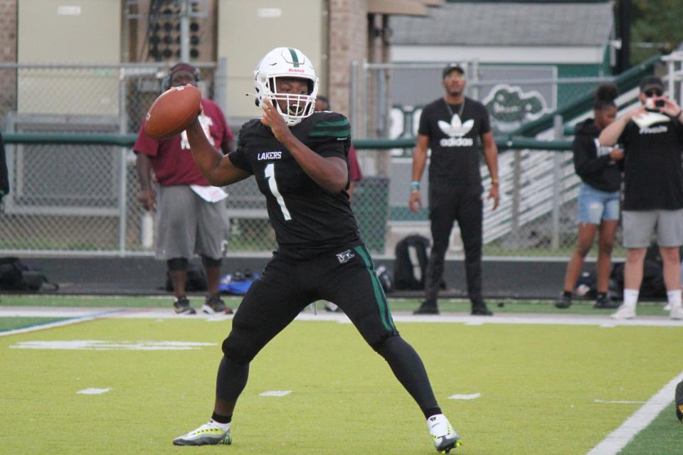 West Bloomfield quarterback Reqez Nance looks to pass during the 33-14 home win over Harper Woods on Friday, Sept. 2, 2022.