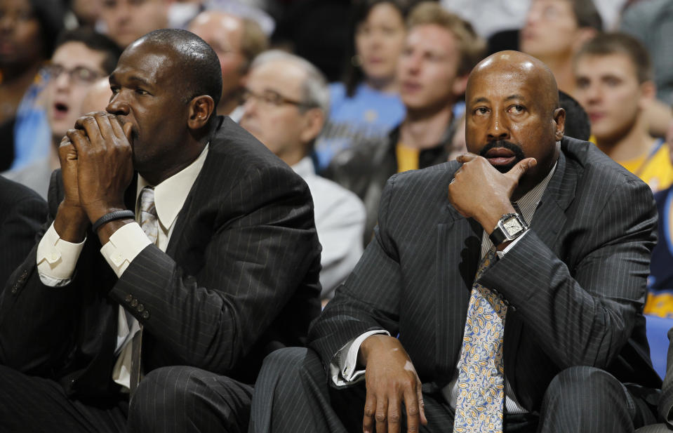 FILe - In this March 13, 2013 file photo, New York Knicks head coach Mike Woodson, right, joins assistant coach Herb Williams in reacting as the Knicks fall behind to the Denver Nuggets in the third quarter of the Nuggets' 117-94 victory in an NBA basketball game in Denver. The Knicks have fired Woodson after falling from division champions to out of the playoffs in one season. New team president Phil Jackson made the decision Monday, April 21, 2014, saying in a statement "the time has come for change throughout the franchise." (AP Photo/David Zalubowski, File)