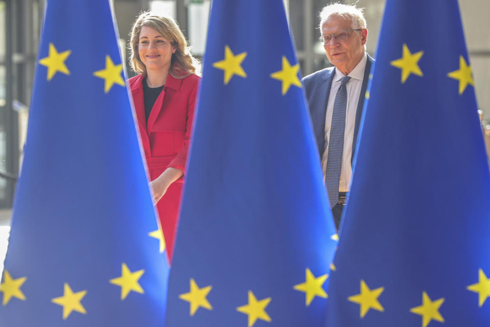 Canadian minister of foreign affairs Mélanie Joly and European Union foreign policy chief Josep Borrell arrive for a meeting of EU foreign ministers at the European Council building in Brussels, Monday, May 16, 2022. European Union foreign ministers on Monday will discuss current affairs and have an exchange of views on the Russian aggression against Ukraine and the Global Gateway. (AP Photo/Olivier Matthys)