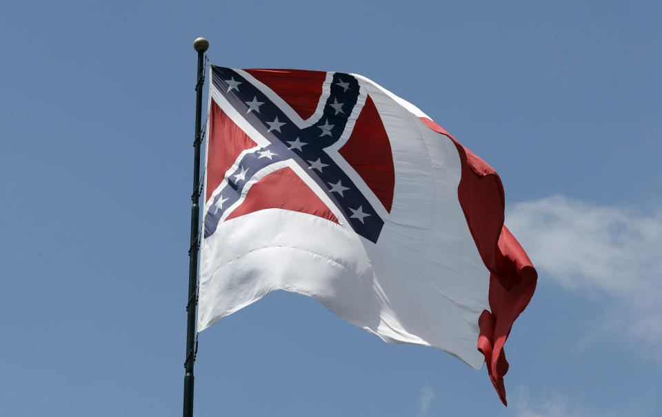 FILE - In this Aug. 17, 2017, file photo, the third national flag of the Confederacy, sometimes referred to as the "Blood-stained banner, is displayed in Tampa, Fla. While the Confederate battle flag with its familiar red background and blue X is the best-known banner of the Confederacy, the nation had three national flags and used multiple other banners. (AP Photo/Chris O'Meara, File)