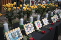 <p>Pictures of victims of the Santa Fe High School shooting are displayed during a prayer vigil at Walter Hall Park on May 20, 2018 in League City, Texas. (Photo: Scott Olson/Getty Images) </p>