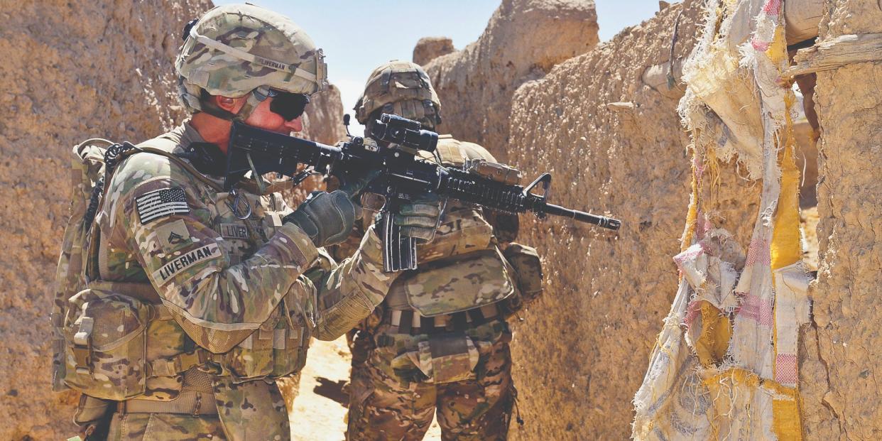 Here, CPL Bobby Liverman of 5th Battalion, 20th Infantry Regiment clears an area in the district of Spin Boldak, Kandahar province, Afghanistan, Sept. 9 during Operation Southern Strike III.