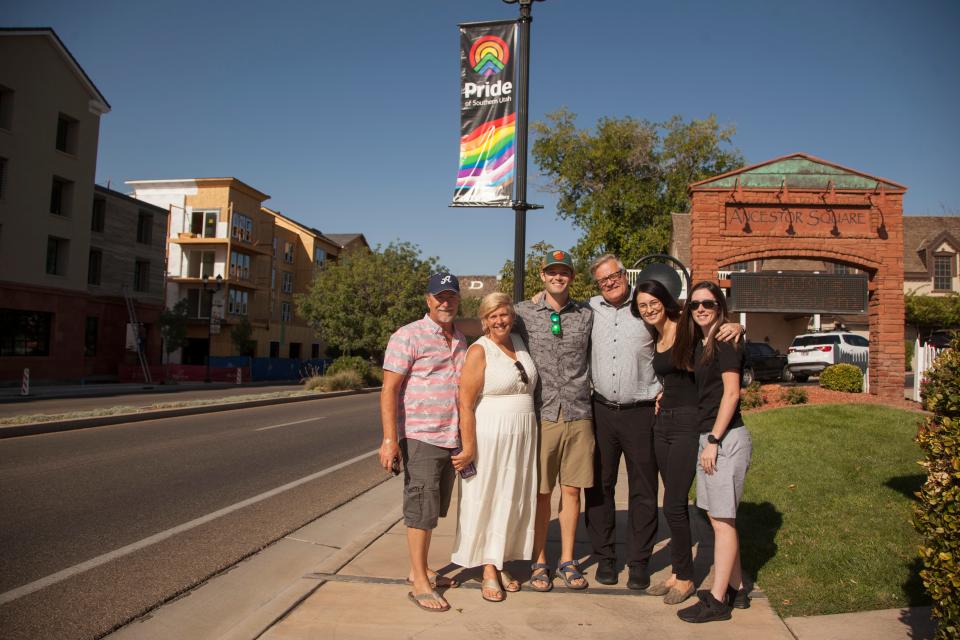 Representatives from Equality Utah and Pride of Southern Utah pose under a newly placed Pride banner on St. George Boulevard on Sept. 9 in anticipation of Pride Week in St. George, Utah.