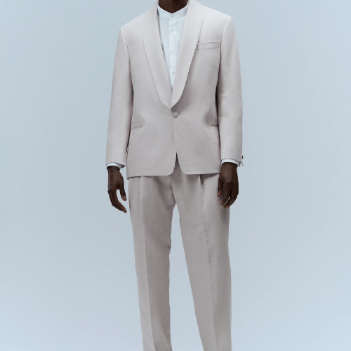 man wearing beige hugo boss linen and cotton suit