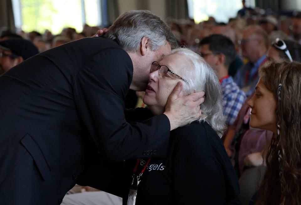 David Blankenhorn, founder and president of the Institute for American Values and Braver Angels, embraces Rita Chisum after Chisum spoke about a friendship strained by political differences at the Braver Angels National Convention at Gettysburg College in Gettysburg, Pa., on Thursday, July 6, 2023. | Kristin Murphy, Deseret News