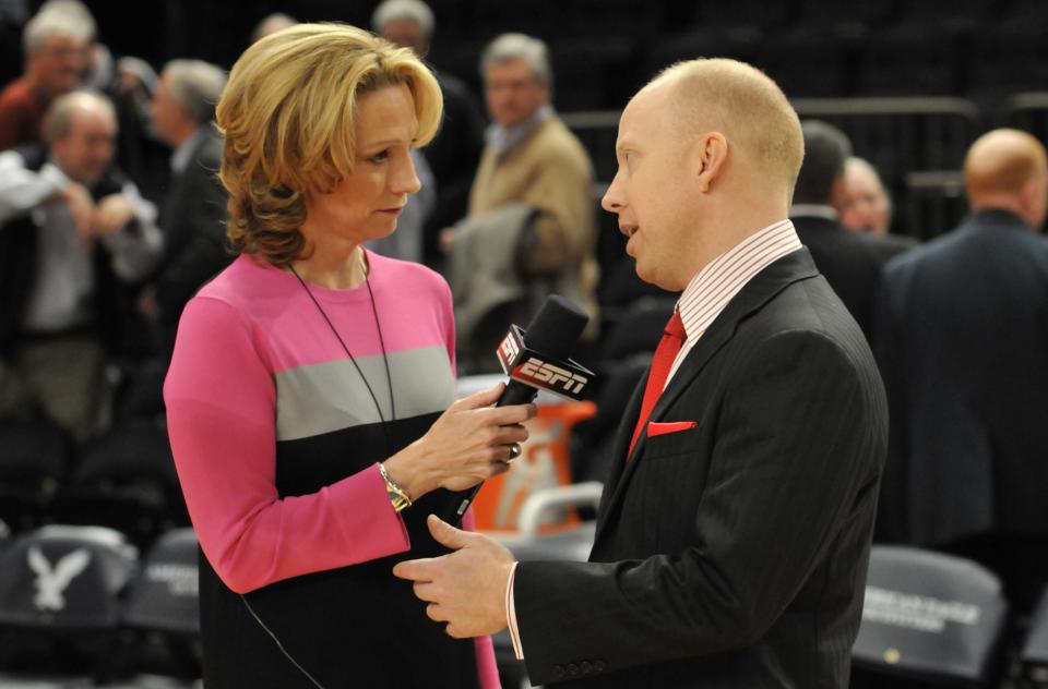 NEW YORK - MARCH 8, 2012: Mick Cronin, head coach of the Cincinnati Bearcats interviewed by ESPN's Beth Mowins after defeating the Georgetown Hoyas in the quarterfinal round of the BIG EAST Men's Basketball Championship at Madison Square Garden. Cincinnati won 72-70 (Photo by Tom Maguire/BIG EAST Conference/Collegiate Images via Getty Images) 